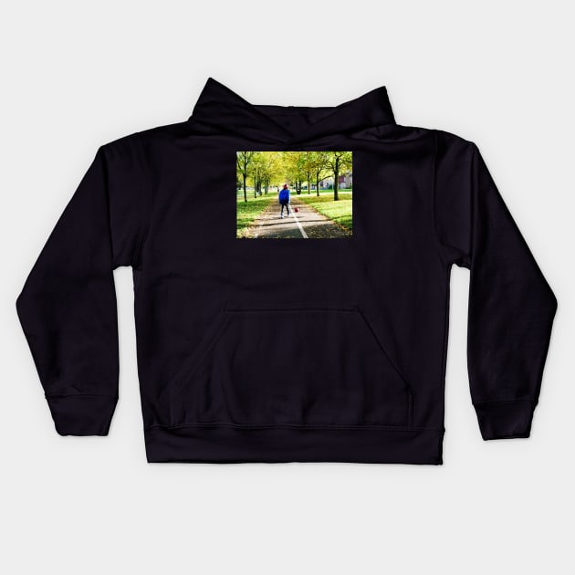 Boy playing football in autumn Kids Hoodie by fantastic-designs
